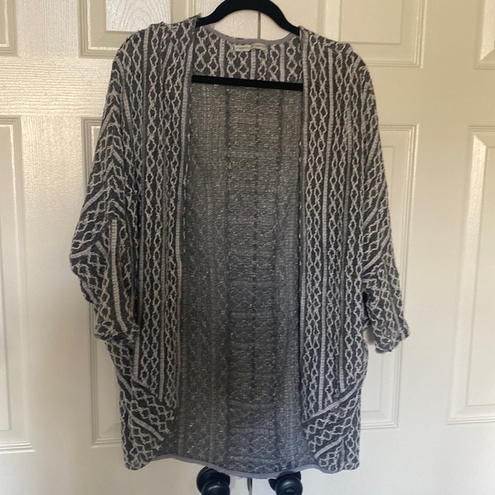 Gray and white cardigan sweater